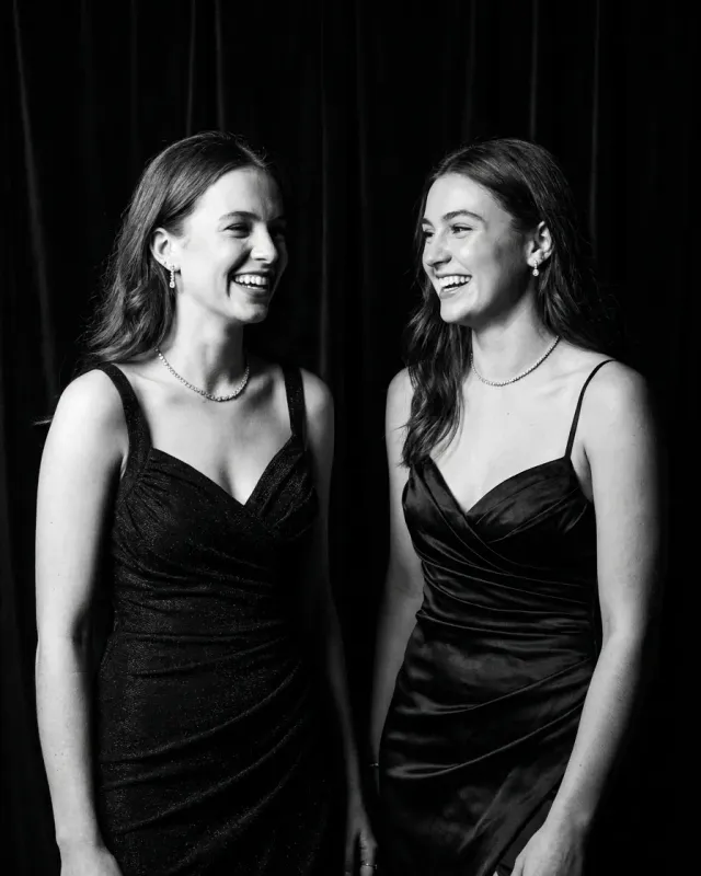 Concept portrait of friends laughing together in evening dress